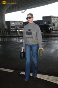 actress Malaika Arora chic look in t-shirt and jeans at mumbai airport