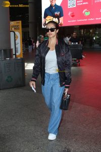 actress malaika arora in a black jacket and denim jeans
