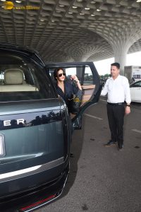 actress Malaika Arora in a blue dress at mumbai airport