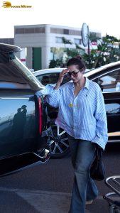 actress malaika arora chic look in a shirt and sunglasses