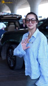 actress malaika arora chic look in a shirt and sunglasses