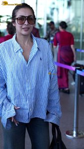 actress malaika arora chic look in a shirt and sunglasses