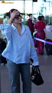 actress malaika arora chic look in a shirt and sunglasses
