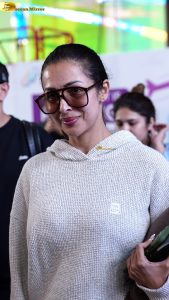 actress malaika arora stylish in a sweatshirt and sunglasses at mumbai airport