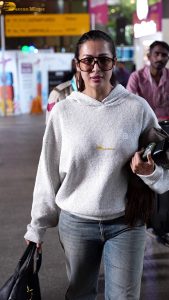 actress malaika arora stylish in a sweatshirt and sunglasses at mumbai airport