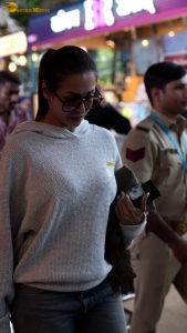 actress malaika arora stylish in a sweatshirt and sunglasses at mumbai airport