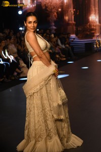 actress malaika arora stunning in a yellow dress doing a ramp walk