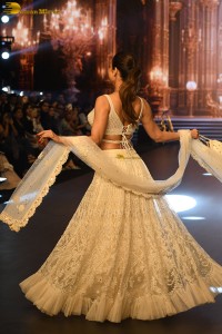 actress malaika arora stunning in a yellow dress doing a ramp walk