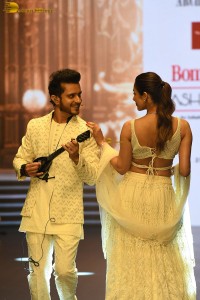 actress malaika arora stunning in a yellow dress doing a ramp walk