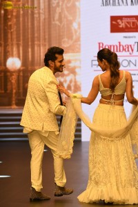 actress malaika arora stunning in a yellow dress doing a ramp walk