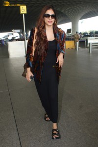 actress malavika mohanan gorgeous looks in a black dress at mumbai airport