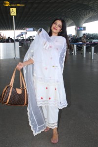 actress Malavika Mohanan shines in a white salwar dress