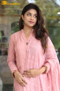 Actress Malavika Satheesan photoshoot in a pink dress