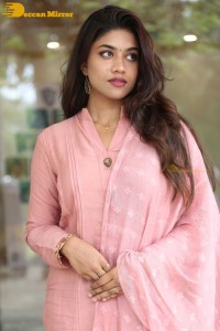Actress Malavika Satheesan photoshoot in a pink dress