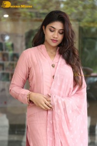 Actress Malavika Satheesan photoshoot in a pink dress