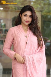Actress Malavika Satheesan photoshoot in a pink dress