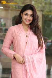 Actress Malavika Satheesan photoshoot in a pink dress
