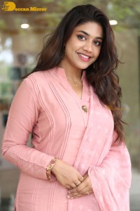 Actress Malavika Satheesan photoshoot in a pink dress