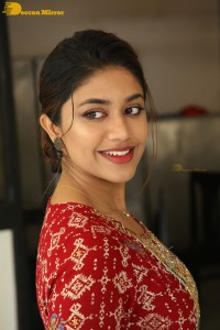 Actress Malavika Satheesan in a red dress