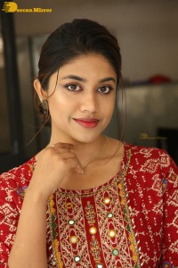 Actress Malavika Satheesan in a red dress