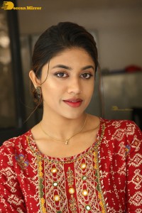 Actress Malavika Satheesan in a red dress