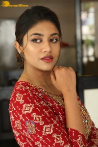 Actress Malavika Satheesan in a red dress