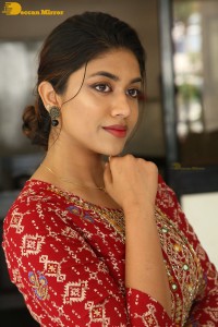 Actress Malavika Satheesan in a red dress