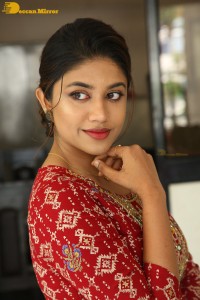 Actress Malavika Satheesan in a red dress
