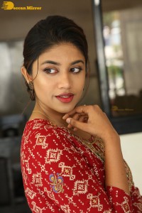 Actress Malavika Satheesan in a red dress