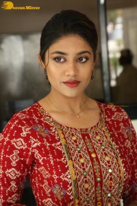 Actress Malavika Satheesan in a red dress