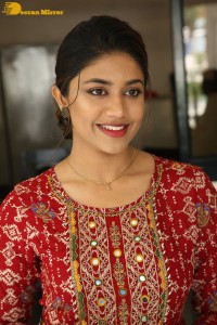 Actress Malavika Satheesan in a red dress