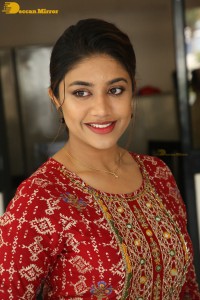 Actress Malavika Satheesan in a red dress