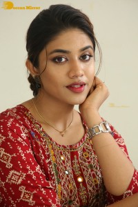 Actress Malavika Satheesan in a red dress