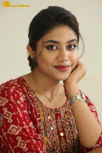 Actress Malavika Satheesan in a red dress