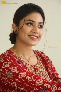 Actress Malavika Satheesan in a red dress