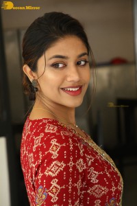 Actress Malavika Satheesan in a red dress