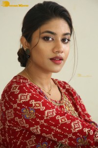 Actress Malavika Satheesan in a red dress