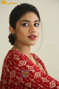 Actress Malavika Satheesan in a red dress