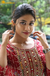 Actress Malavika Satheesan in a red dress