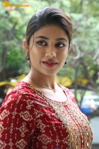 Actress Malavika Satheesan in a red dress