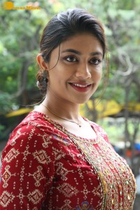 Actress Malavika Satheesan in a red dress