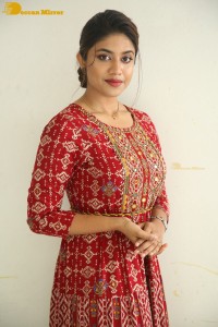 Actress Malavika Satheesan in a red dress