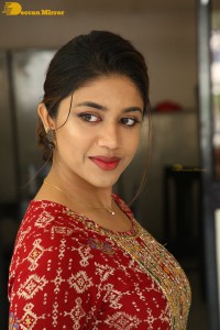 Actress Malavika Satheesan in a red dress