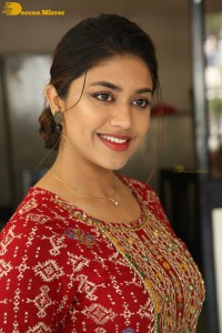 Actress Malavika Satheesan in a red dress