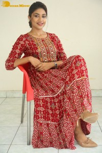 Actress Malavika Satheesan in a red dress