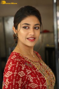 Actress Malavika Satheesan in a red dress