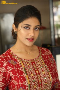 Actress Malavika Satheesan in a red dress
