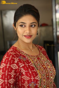 Actress Malavika Satheesan in a red dress