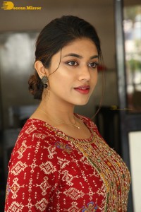 Actress Malavika Satheesan in a red dress