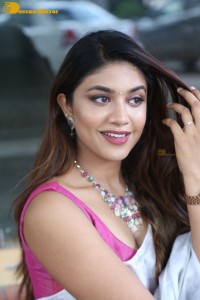 Actress Malavika Satheesan in a white saree